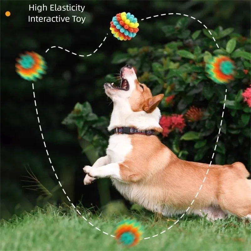 Multicolour durable rubber dog teething ball in red yellow and teal for dental cleaning and interactive play