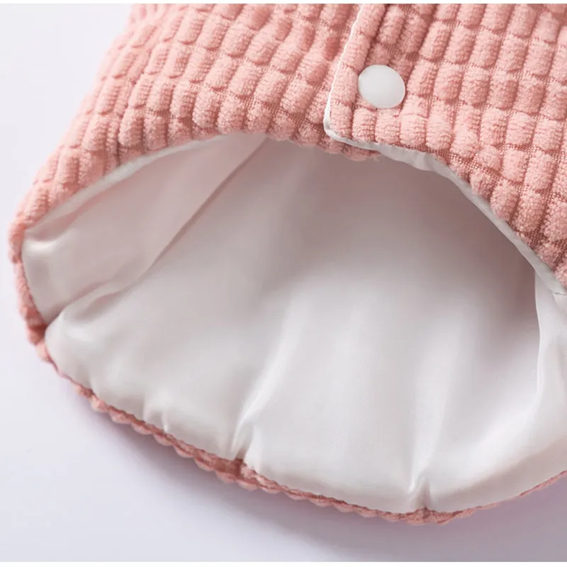 Pink corduroy dog vest with metal leash ring, cotton lining, and bear emblem tag, for small and medium dogs