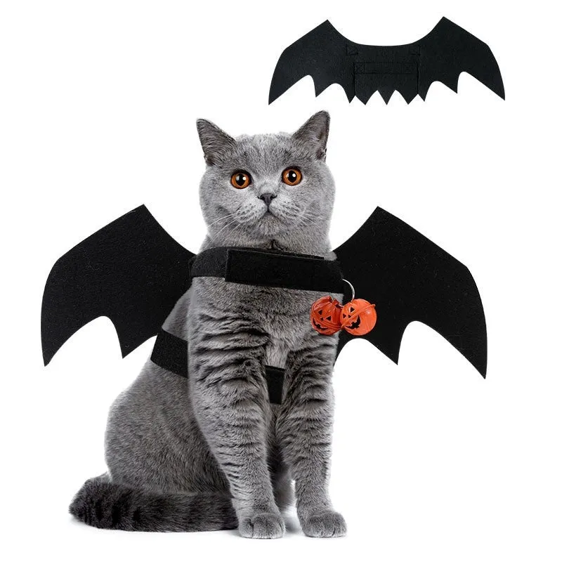 Black wings Halloween felt costume for a dog or cat, shown with a bell accessory.