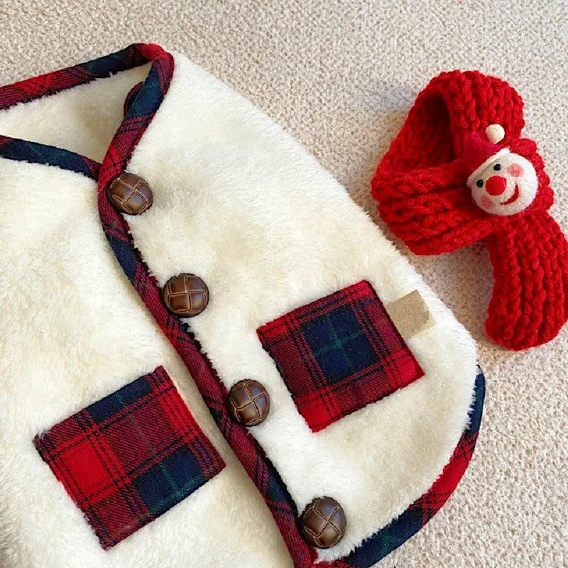 Red and navy blue checkered pet fleece jacket with Sherpa lining and snowman accent on a small dog