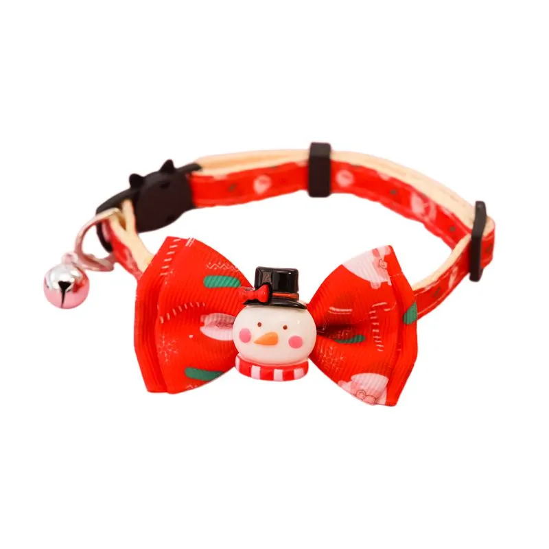 Christmas pet collar with bow tie, bell, and adjustable strap featuring Santa Claus and tree patterns