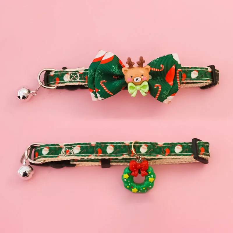 Christmas pet collar with bow tie, bell, and adjustable strap featuring Santa Claus and tree patterns