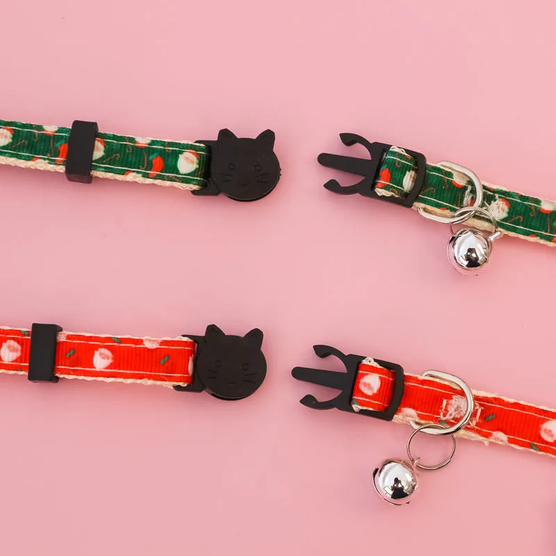 Christmas pet collar with bow tie, bell, and adjustable strap featuring Santa Claus and tree patterns