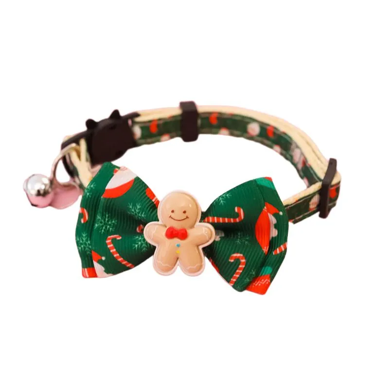 Christmas pet collar with bow tie, bell, and adjustable strap featuring Santa Claus and tree patterns
