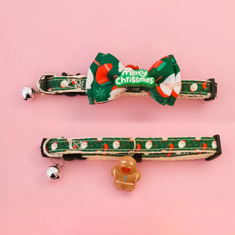 Christmas pet collar with bow tie, bell, and adjustable strap featuring Santa Claus and tree patterns