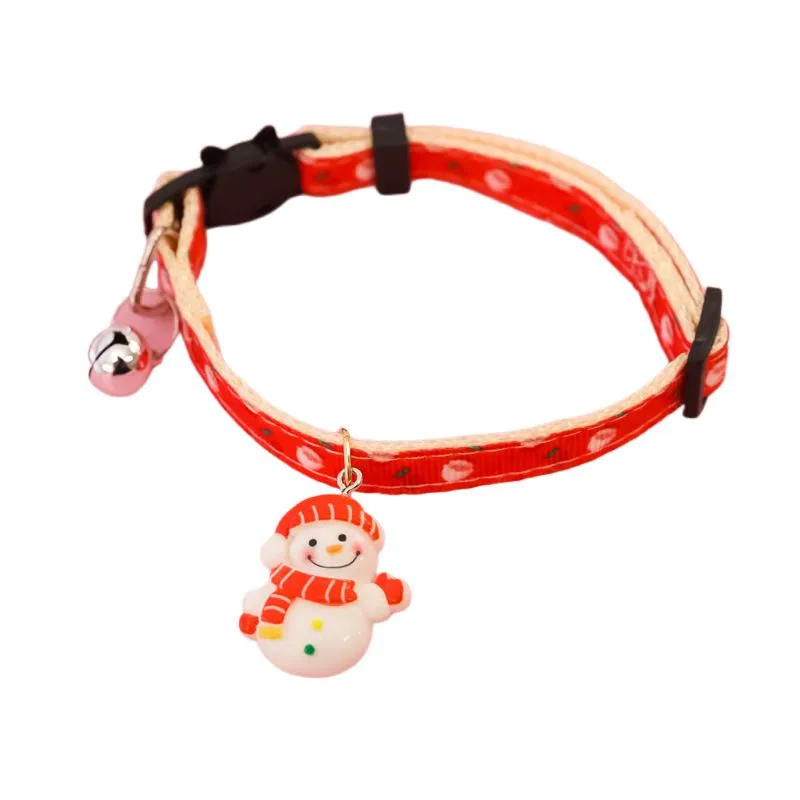 Christmas pet collar with bow tie, bell, and adjustable strap featuring Santa Claus and tree patterns