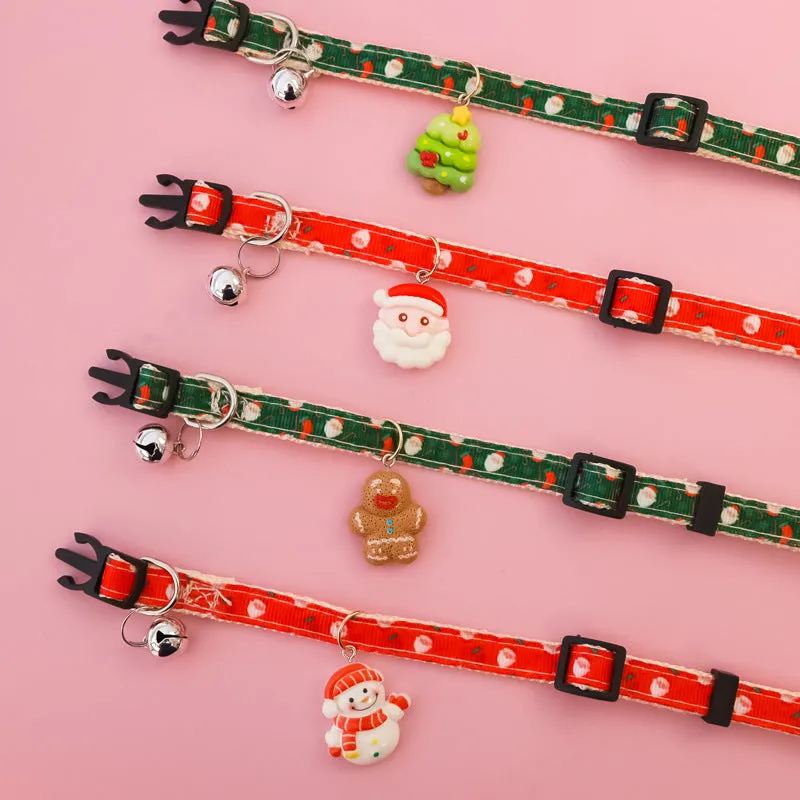 Christmas pet collar with bow tie, bell, and adjustable strap featuring Santa Claus and tree patterns