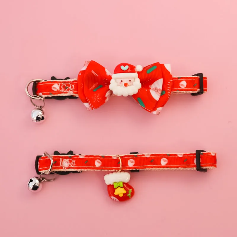 Christmas pet collar with bow tie, bell, and adjustable strap featuring Santa Claus and tree patterns