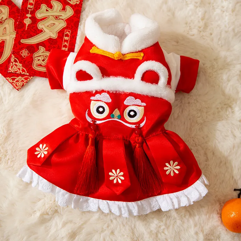Red lion dance pet costume with embroidery and tassels on a dog