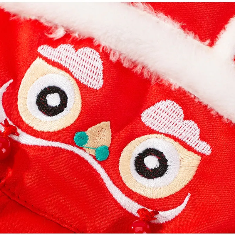 Red lion dance pet costume with embroidery and tassels on a dog