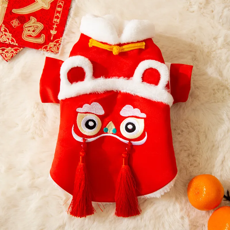 Red lion dance pet costume with embroidery and tassels on a dog