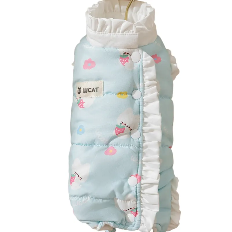 Small dog wearing cream fleece jumpsuit with bear pattern and white ruffles