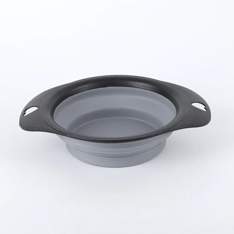Black silicone pet bowl shown both folded flat and snapped open, next to a dog leash.