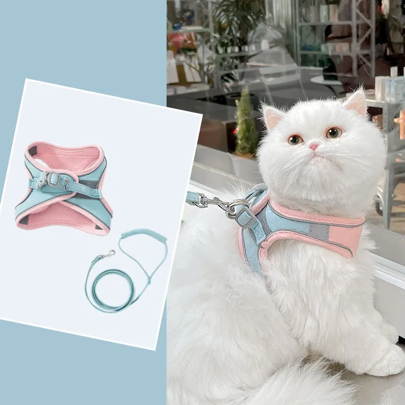 Blue and orange stitched suede cat vest harness with reflective chest strip and attached hand holding rope.