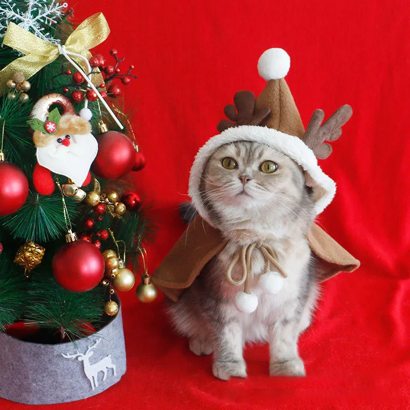 Red polar fleece Christmas cloak with hood for dog or cat wearing antler pattern design.