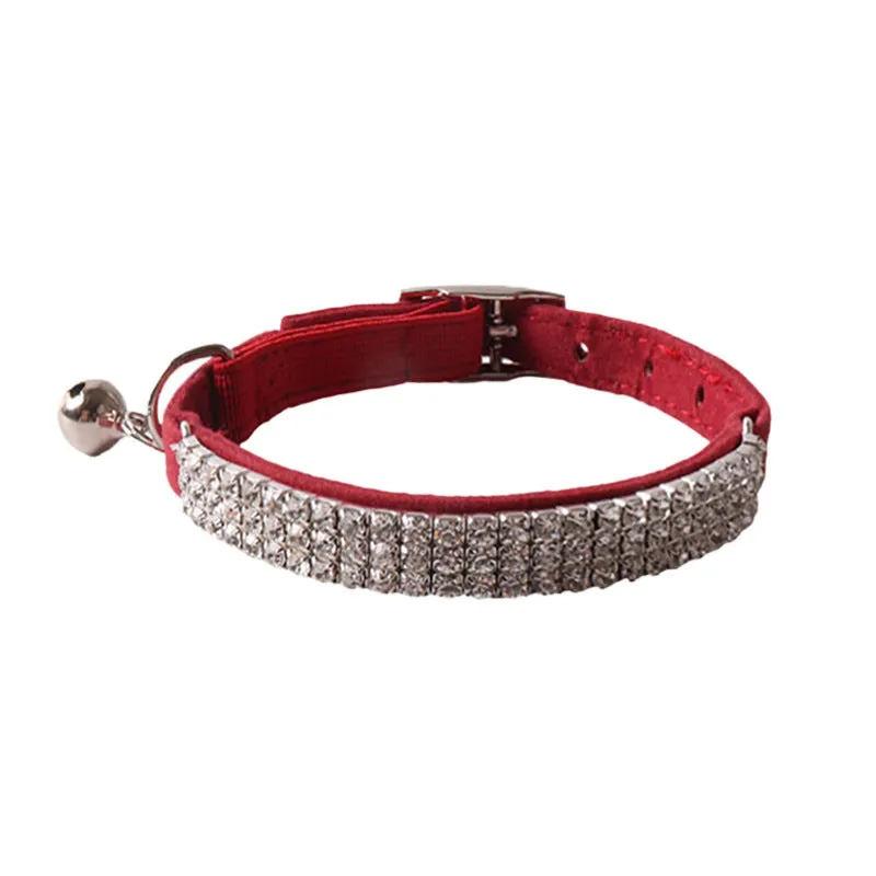 Pink flannel cat collar with elastic buckle and gang drill decoration on a textured flocked material.