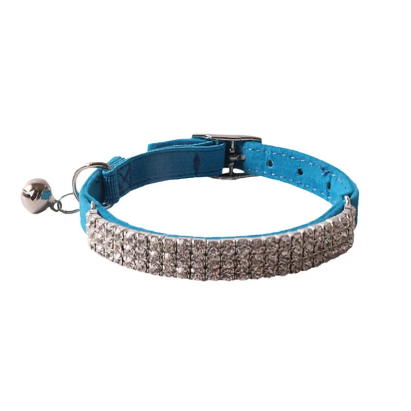 Pink flannel cat collar with elastic buckle and gang drill decoration on a textured flocked material.