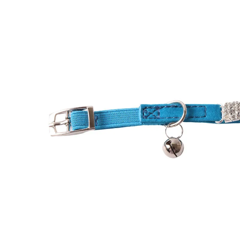 Pink flannel cat collar with elastic buckle and gang drill decoration on a textured flocked material.