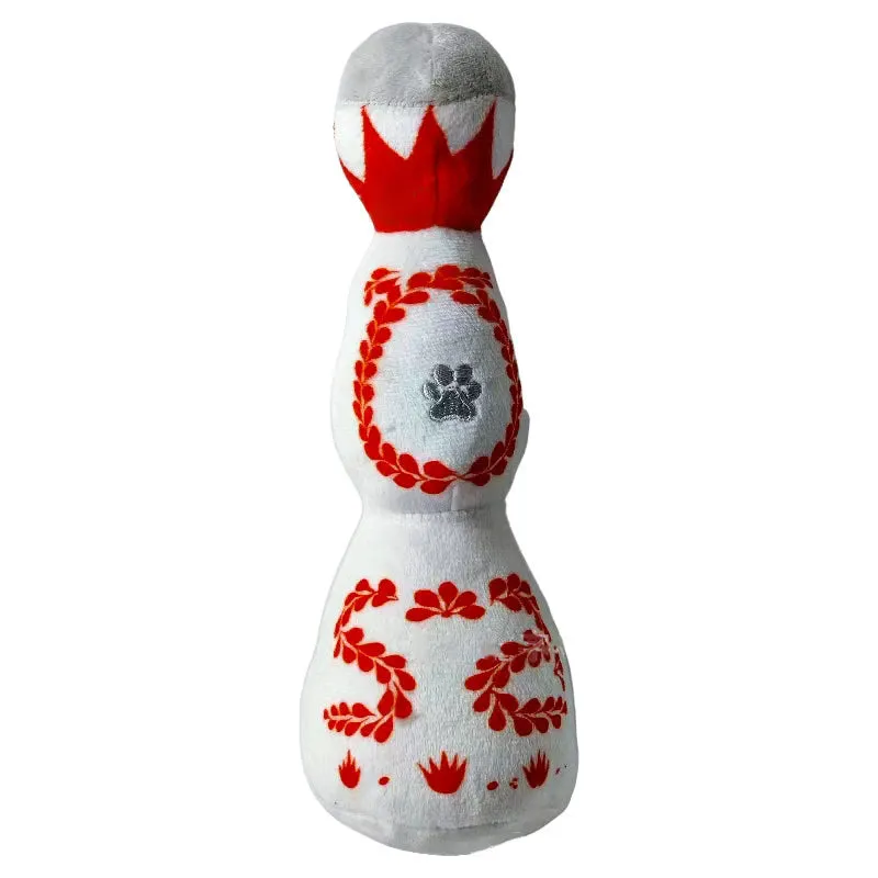 Red and white tequila bottle plush dog toy with squeaker for dogs of all sizes