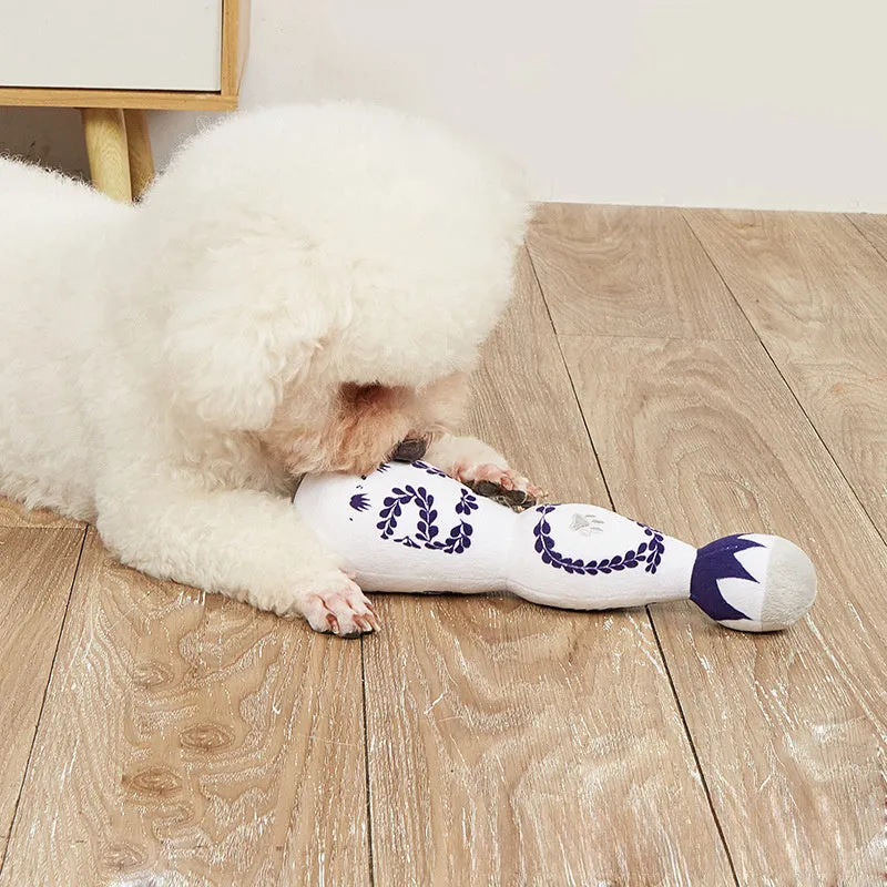 Red and white tequila bottle plush dog toy with squeaker for dogs of all sizes