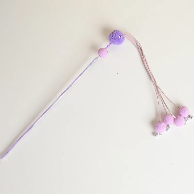 Blue cat toy wand with a fluffy tassel on a stick for interactive pet play.