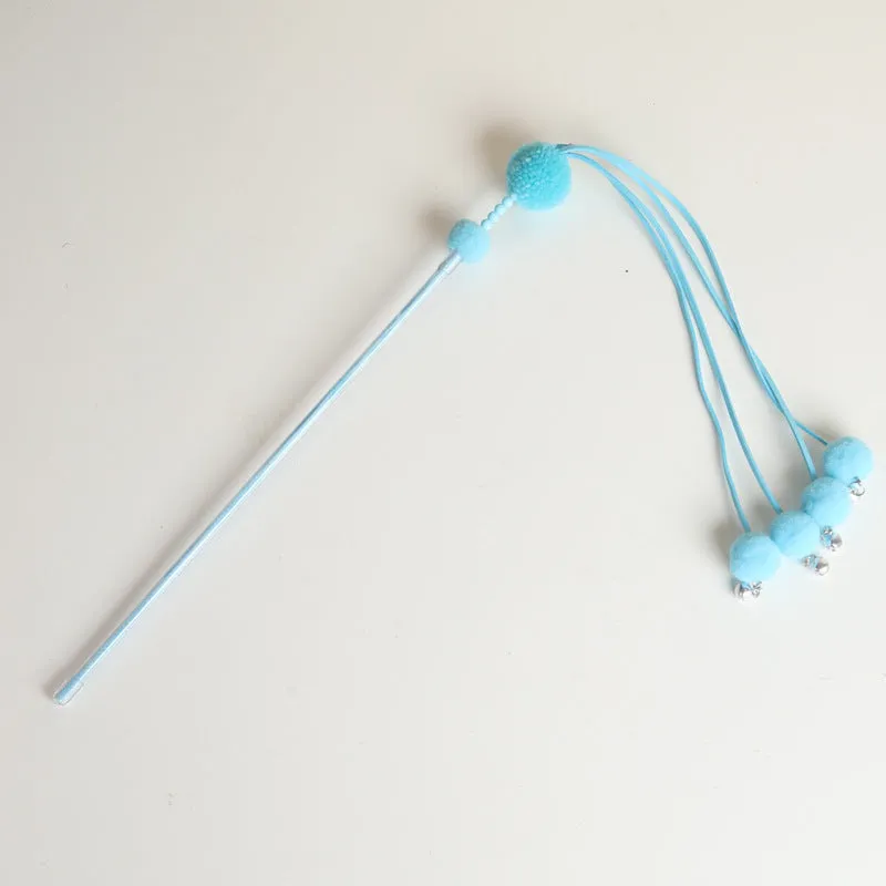 Blue cat toy wand with a fluffy tassel on a stick for interactive pet play.