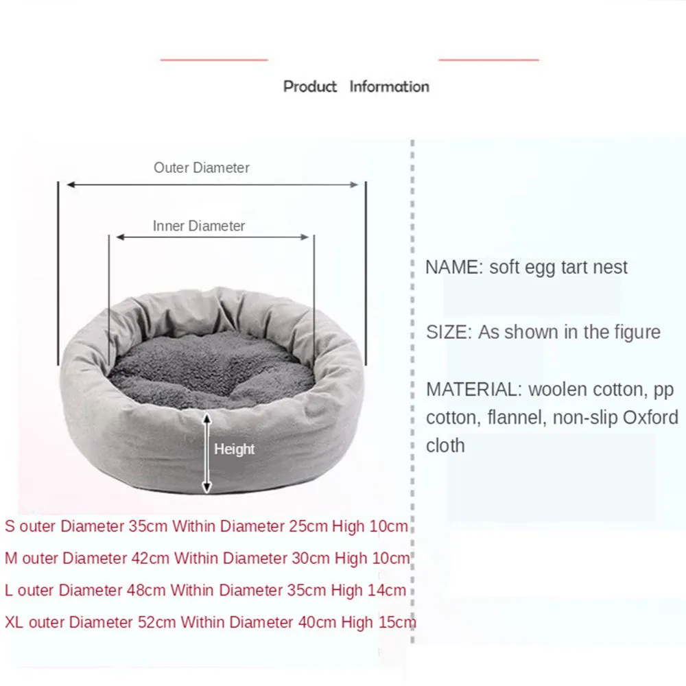 Grey round plush pet bed with raised edge and pillow, shown on a non-slip base.