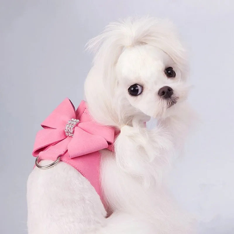 Pink microfiber dog chest strap with a bowknot, showing the harness design.