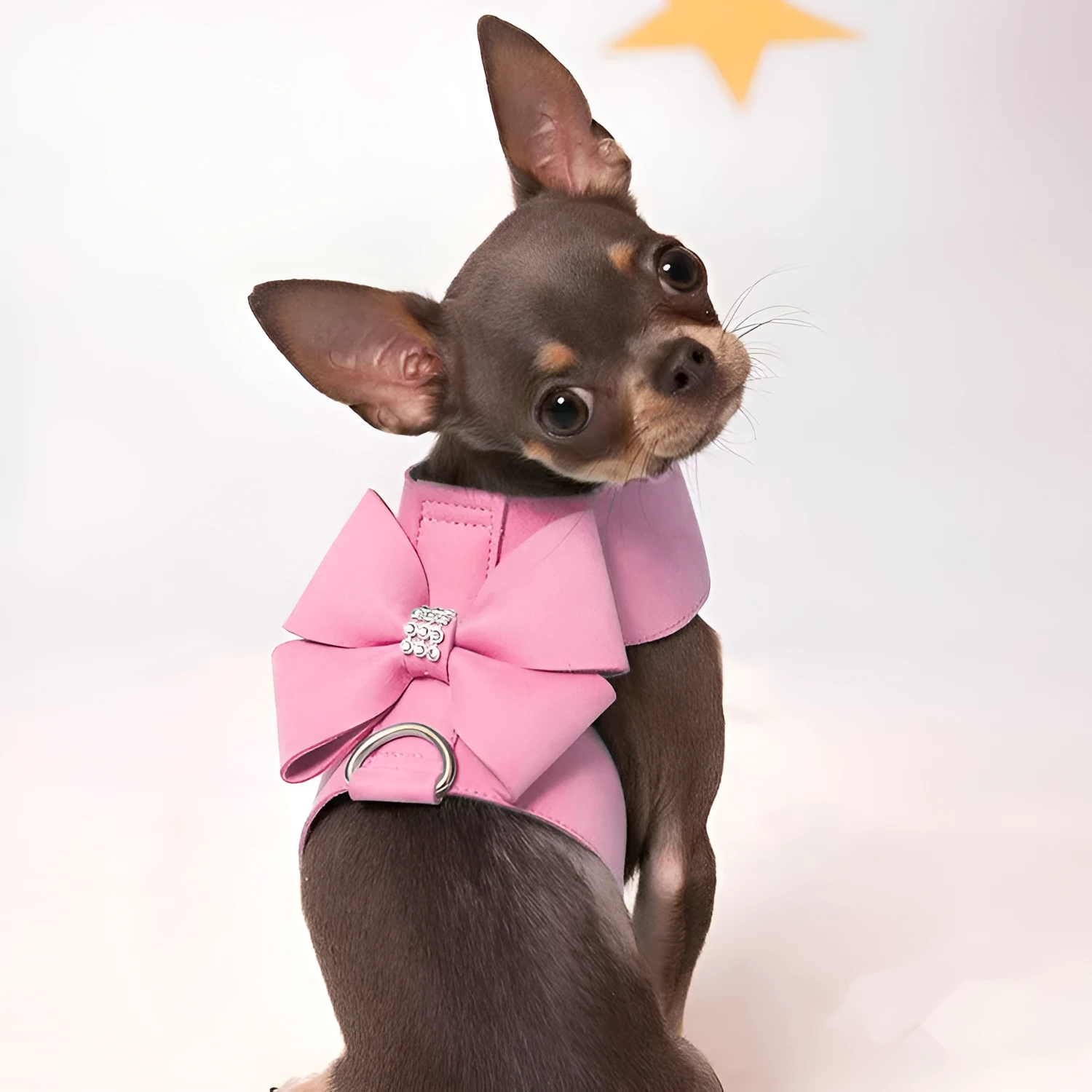 Pink microfiber dog chest strap with a bowknot, showing the harness design.