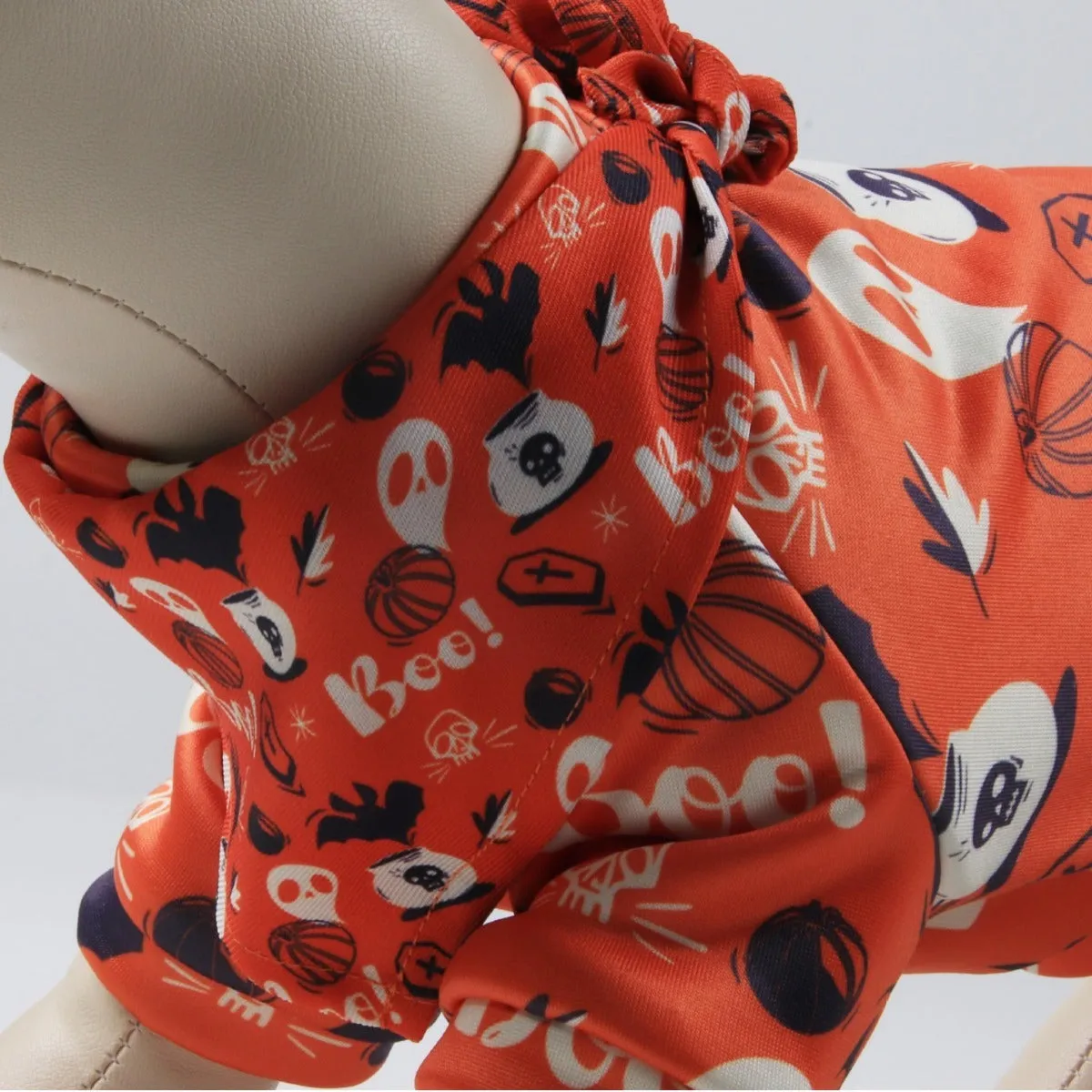 Wansheng fleece-lined dog sweater in an apricot colour with a matching triangular scarf, shown on a model dog.