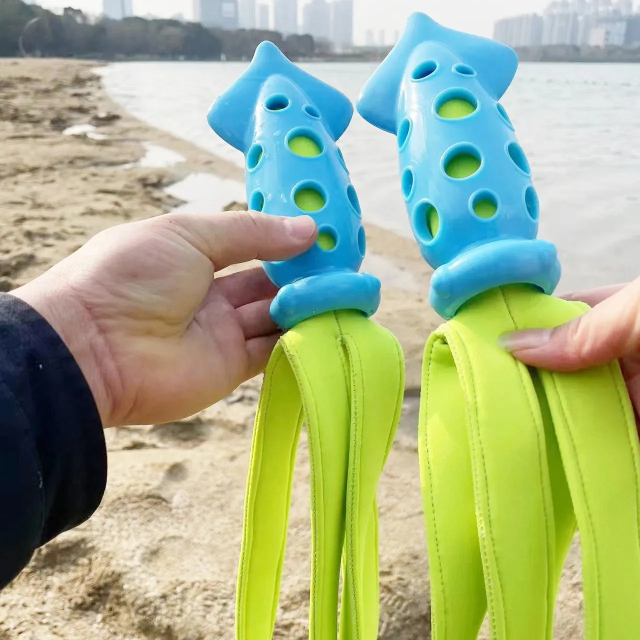 Blue cuttlefish-shaped dog chew toy with textured surface and squeaker for teeth cleaning
