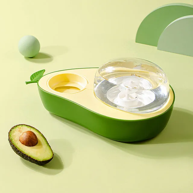 Green avocado-shaped pet feeder with automatic water bottle and separate food bowl