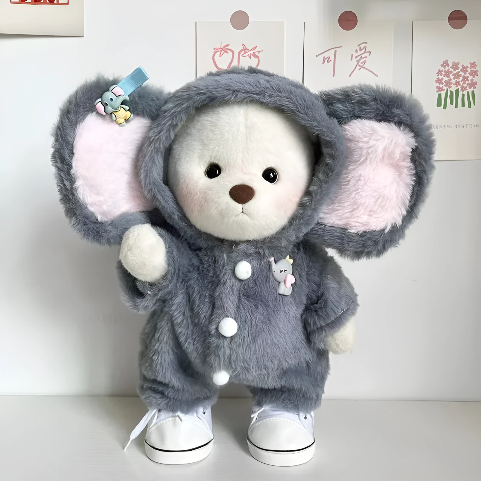 Grey elephant costume jumpsuit for a 30cm plush teddy bear on a neutral background.