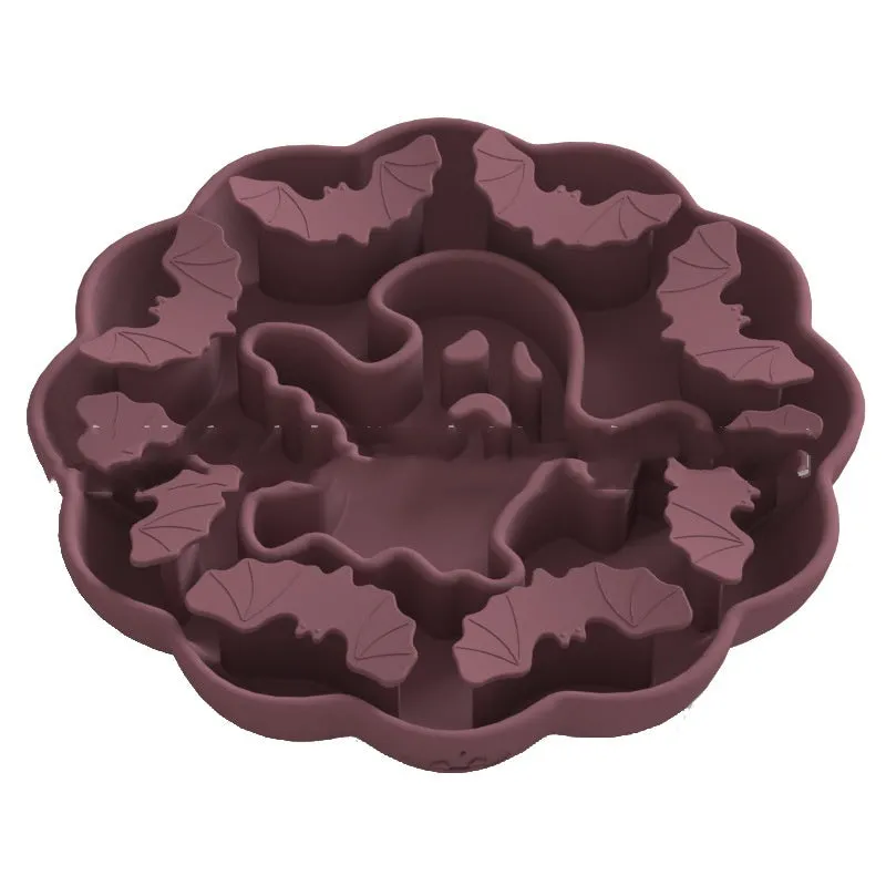 Silicone slow feeder dog bowl with anti-tumble base in Halloween colour theme on a kitchen floor