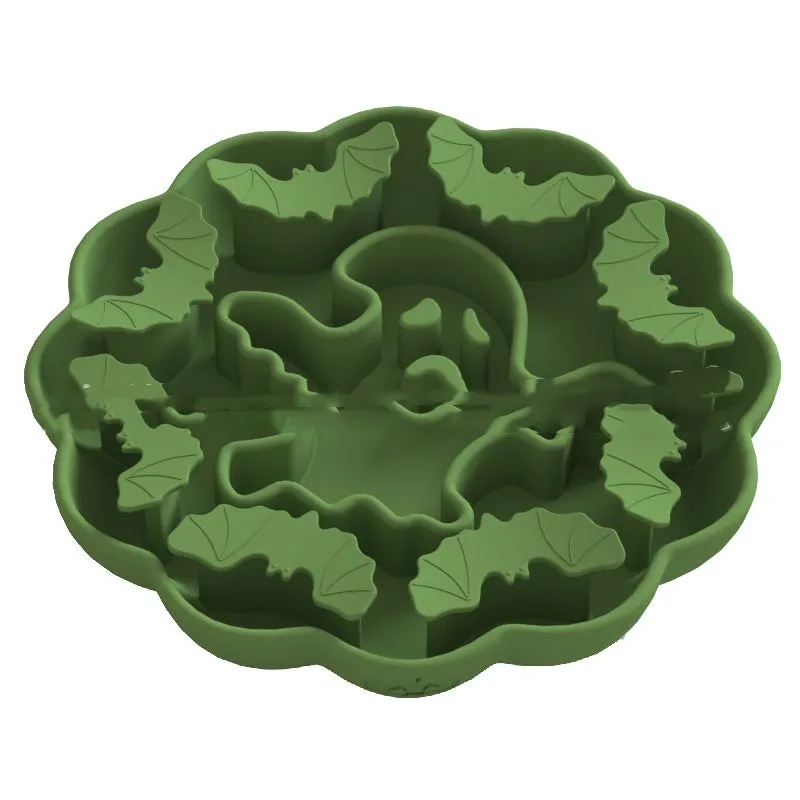 Silicone slow feeder dog bowl with anti-tumble base in Halloween colour theme on a kitchen floor