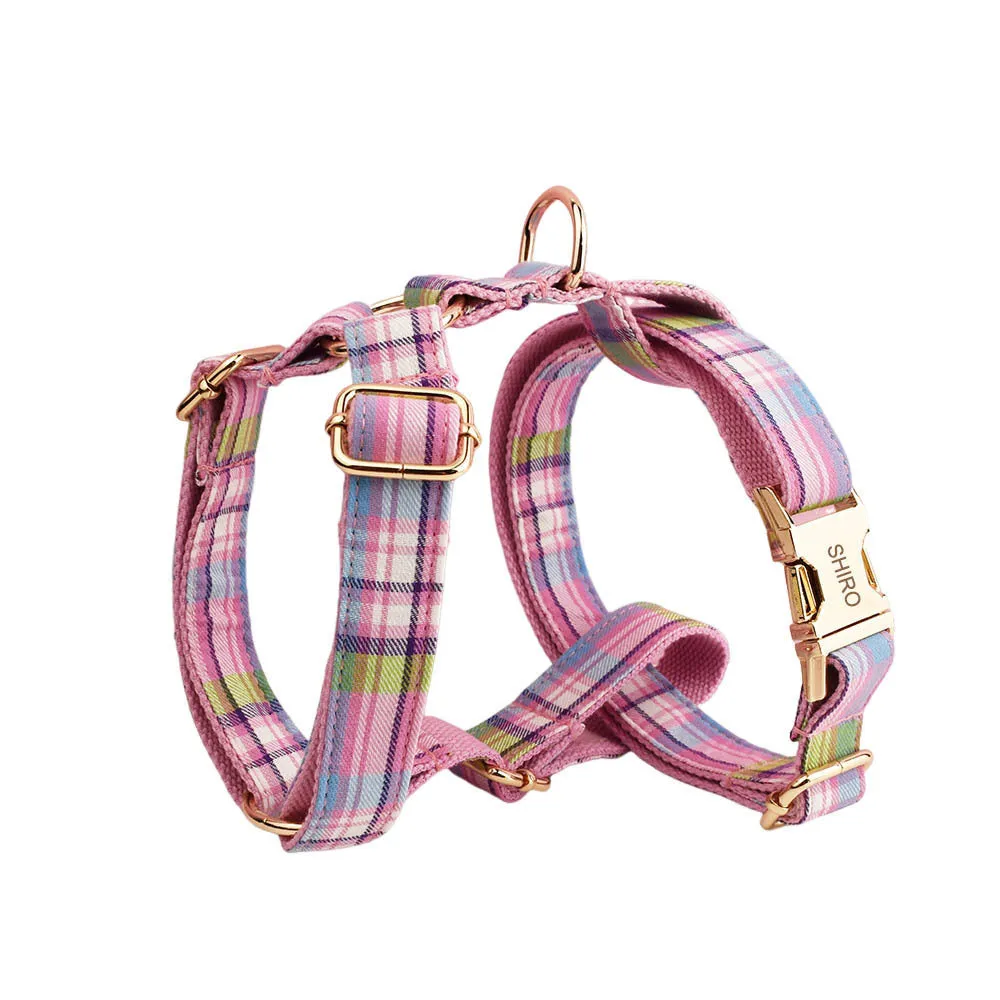 Four-piece cloth dog accessory set showing collar, leash, vest, and bow for coordinated pet styling