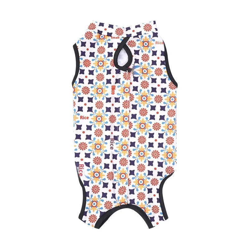 Cat wearing a patterned post-operative recovery suit with Velcro fastenings.