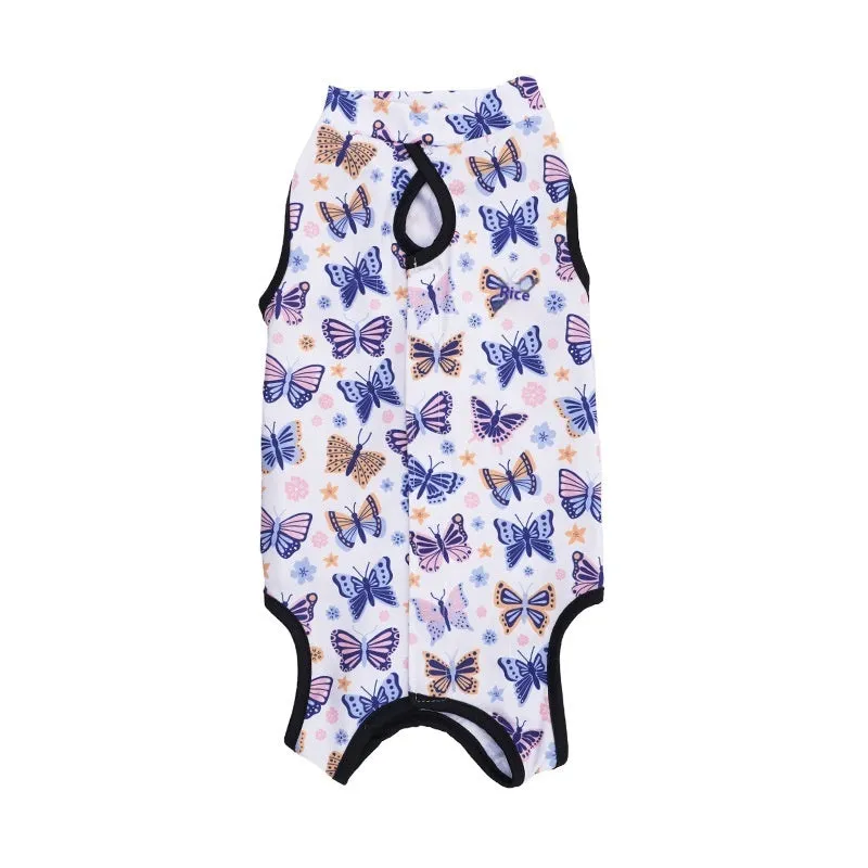 Cat wearing a patterned post-operative recovery suit with Velcro fastenings.