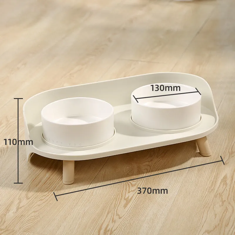 Green and white adjustable tilted pet feeding bowl with dual food and water compartments for cats and dogs
