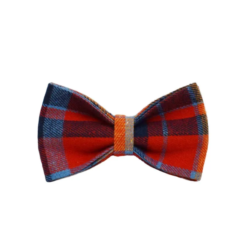 Gentleman-style dog collar, leash, bow, and vest four-piece cloth pet accessory set laid out flat.