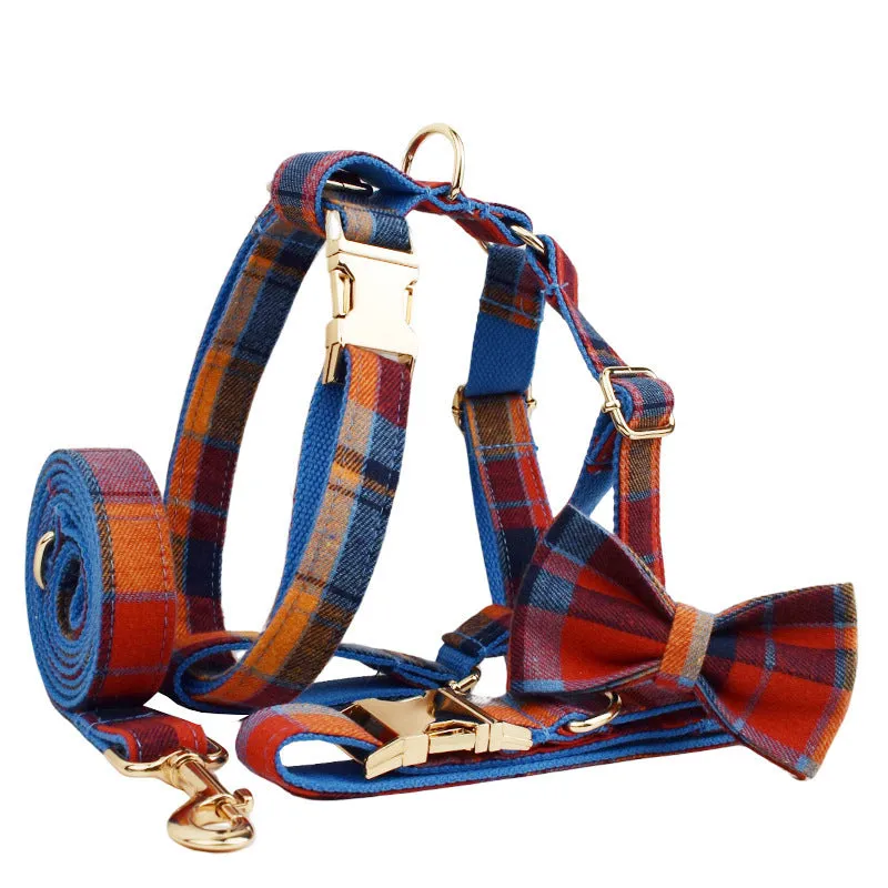 Gentleman-style dog collar, leash, bow, and vest four-piece cloth pet accessory set laid out flat.