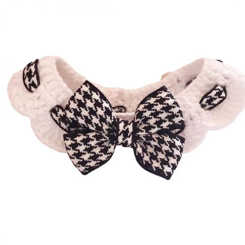 A black and red houndstooth patterned wool knitted collar for dogs, shown in different sizes.