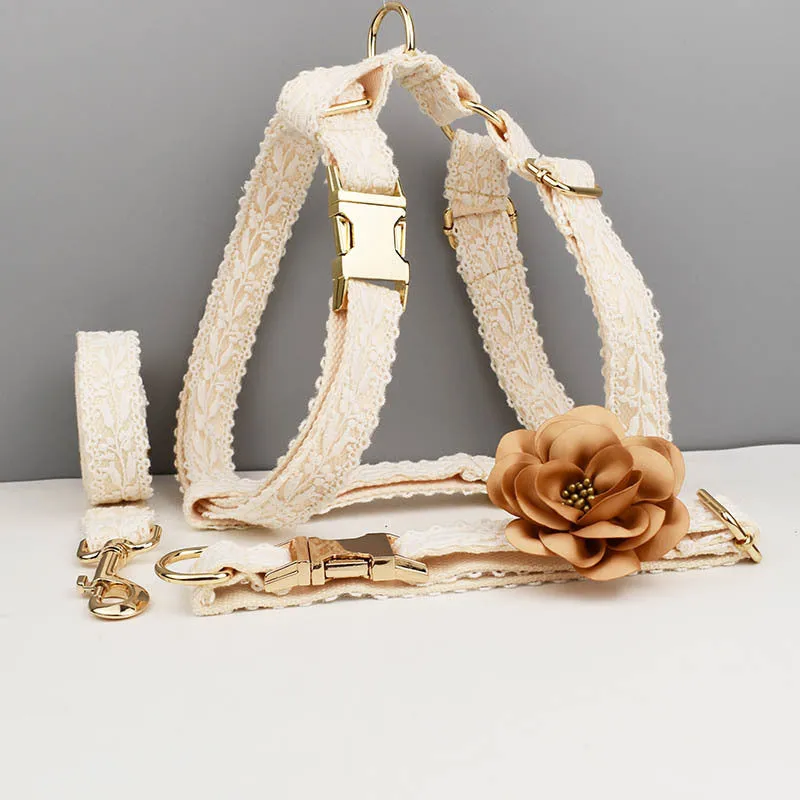 Four-piece dog wedding set with lace vest, matching collar, flower headband, and leash on white background
