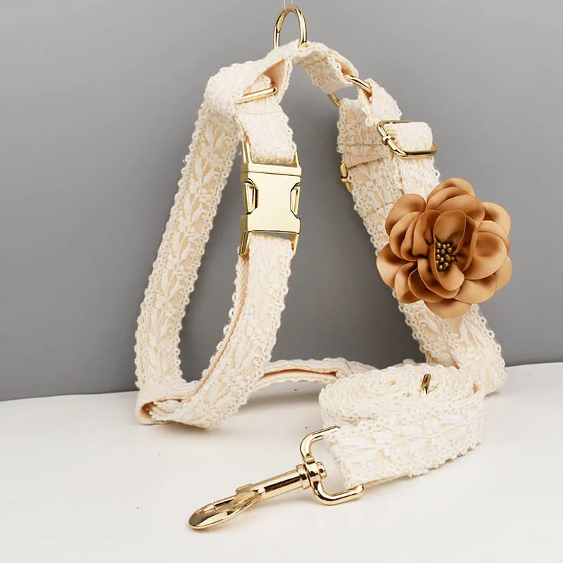 Four-piece dog wedding set with lace vest, matching collar, flower headband, and leash on white background
