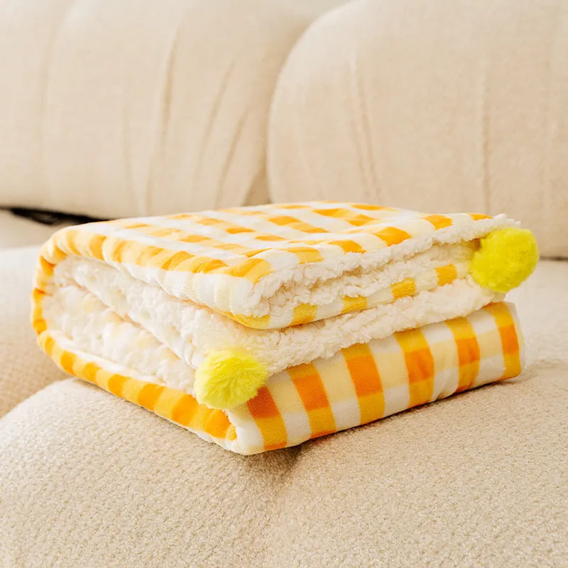 Blue coral fleece pet blanket shown in a large size on a wooden floor