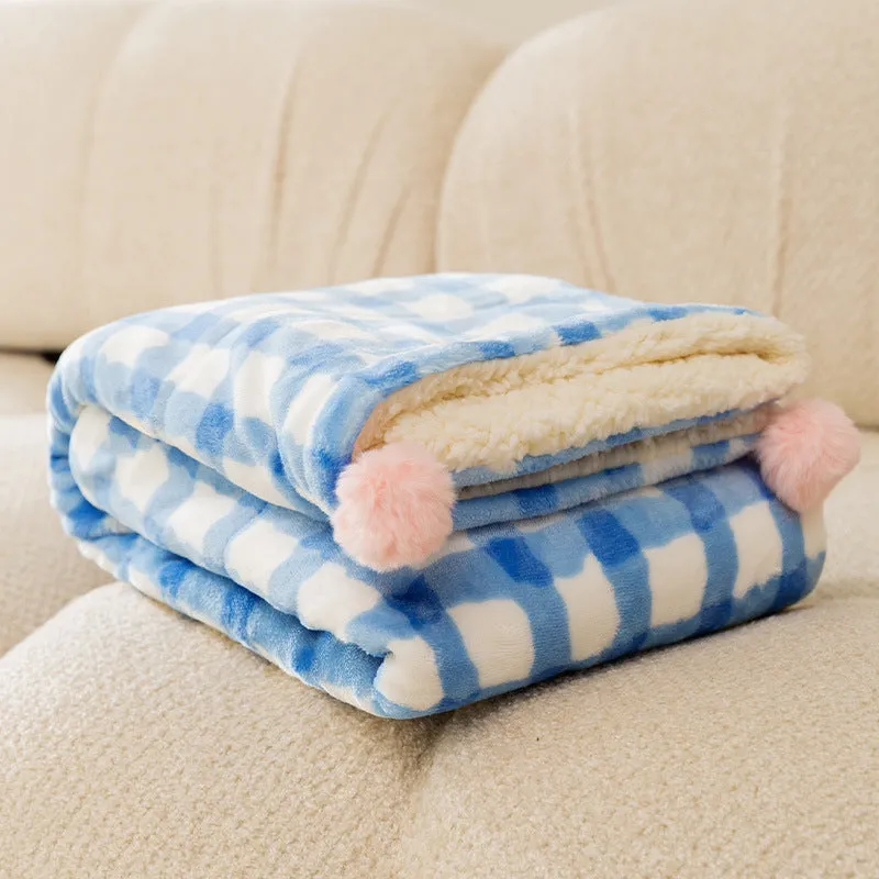 Blue coral fleece pet blanket shown in a large size on a wooden floor