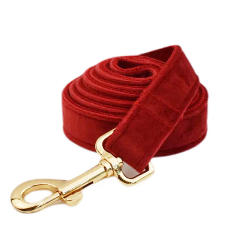 Cloth dog collar set with matching leash, vest, bow, and decorative flower accessories