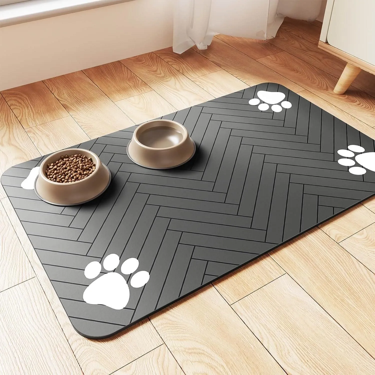 Diatomite pet feeding mat in blue placed under a dog's food and water bowls.