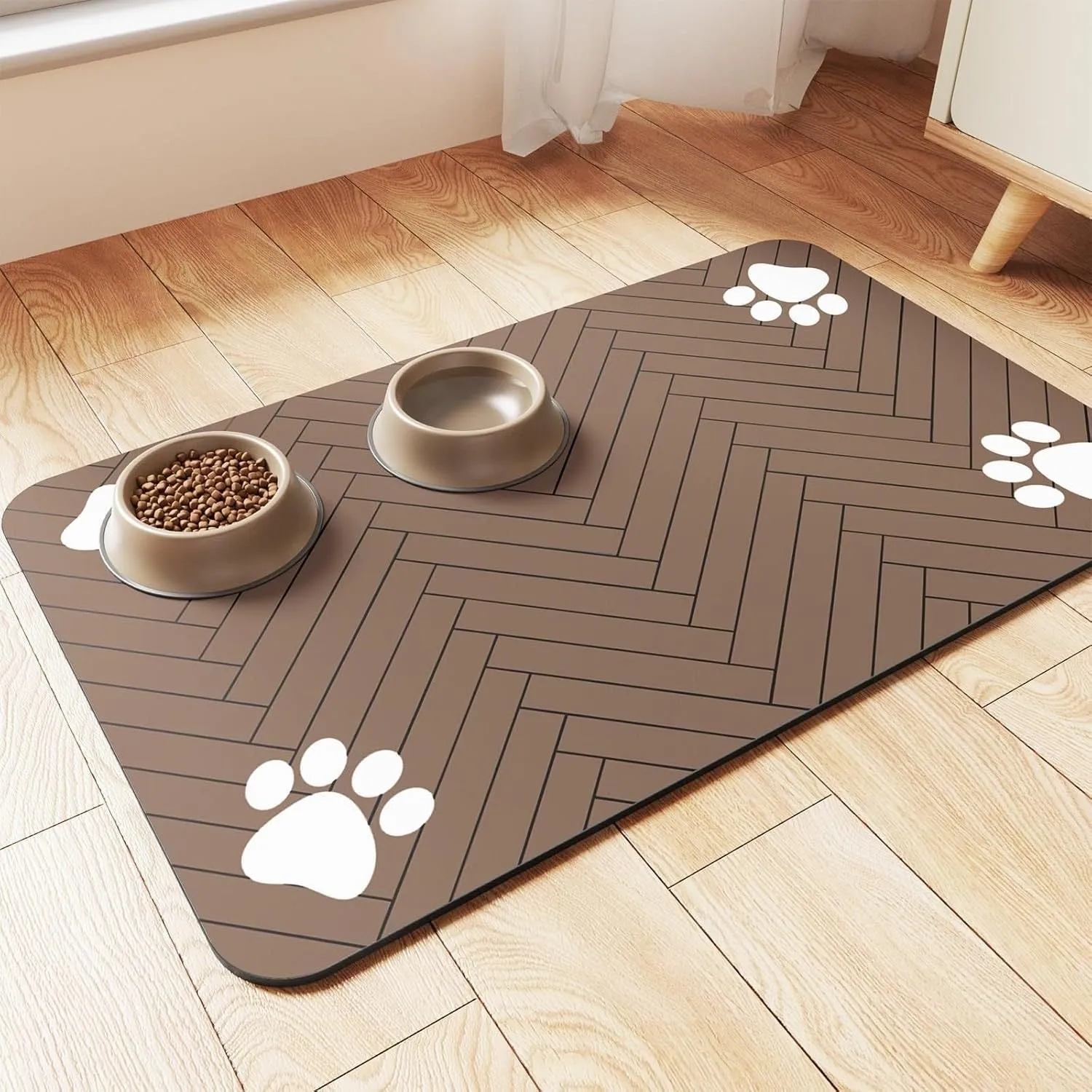 Diatomite pet feeding mat in blue placed under a dog's food and water bowls.