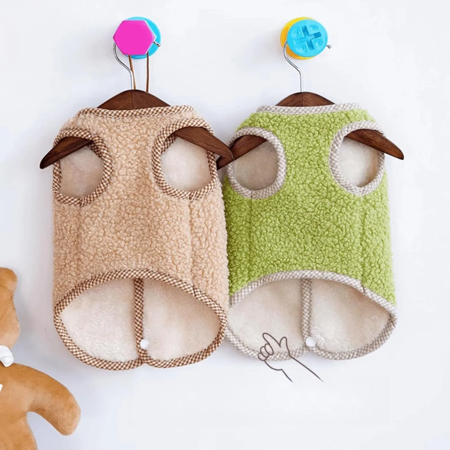 Green coral fleece dog sweatshirt vest with a leash ring on a small dog.
